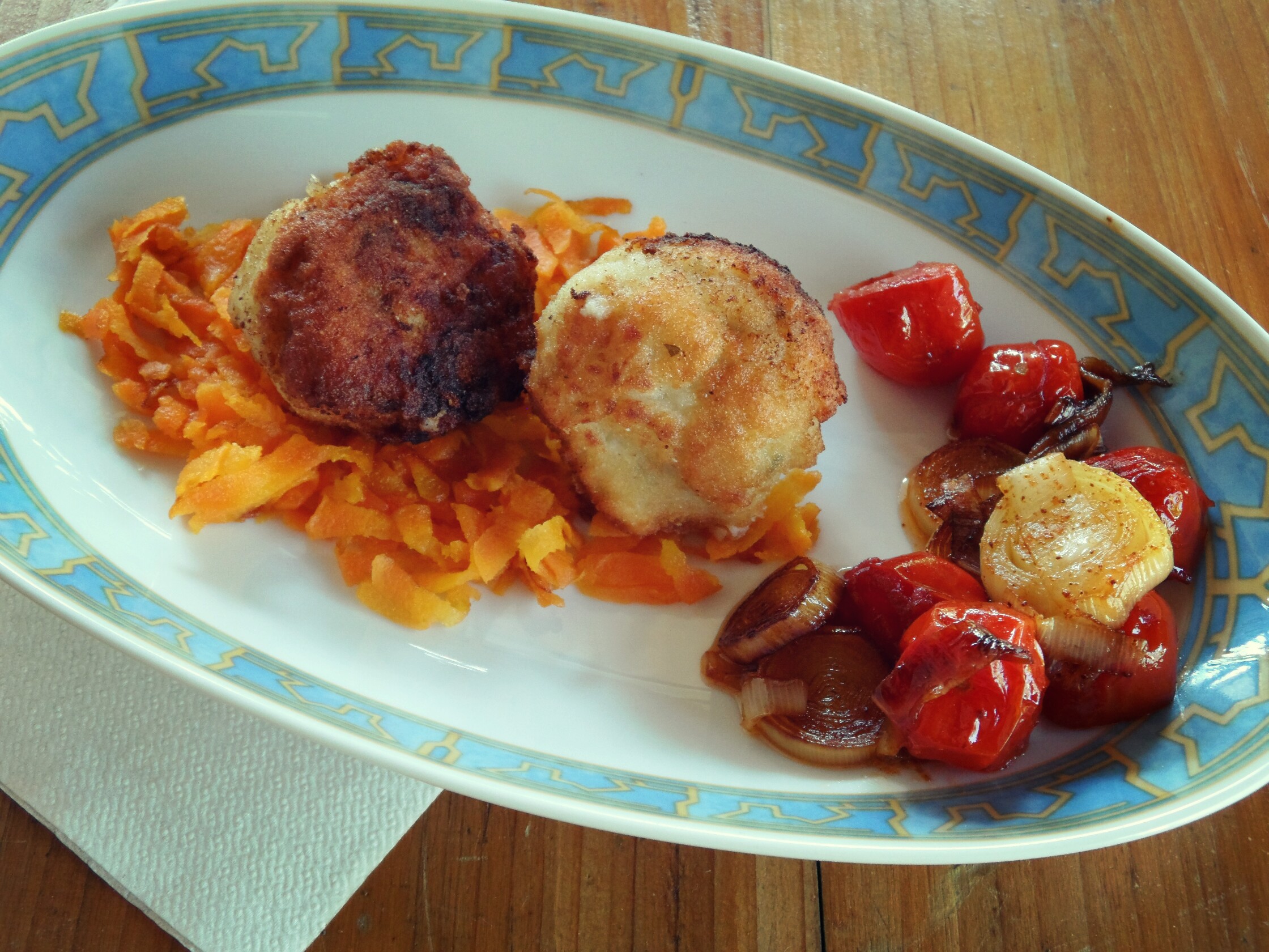 Fishballs with stewed carrots and cherry potatoes and paprika leek