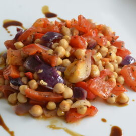 Baked sweet and sour chickpeas with onions, peppers and tomatoes