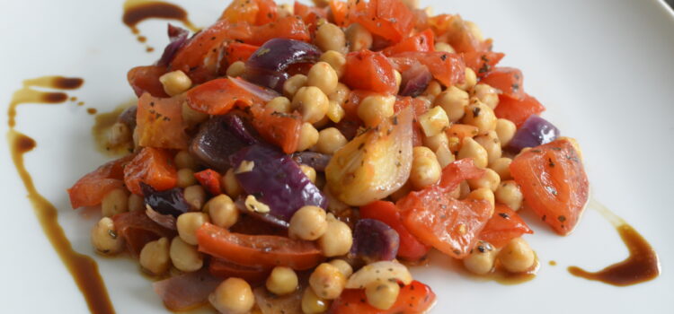 Baked sweet and sour chickpeas with onions, peppers and tomatoes