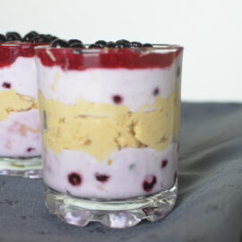 Glasses of peanut butter, berries and yoghurt mousse