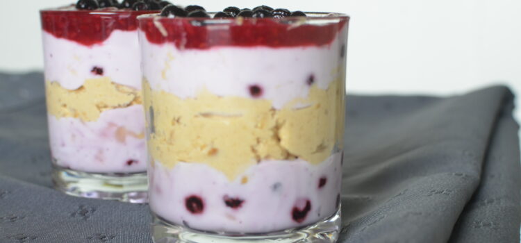Glasses of peanut butter, berries and yoghurt mousse
